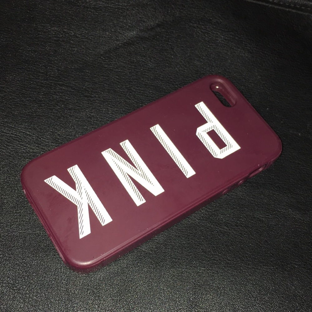 A maroon Victoria secret iPhone 5s phone case